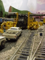 When trains "leave the reservation" and try to create their own way, derailment services have to be called in to rectify the situation.  Two sidewinders belly up to the errant C30-7 and work it back onto good rail.